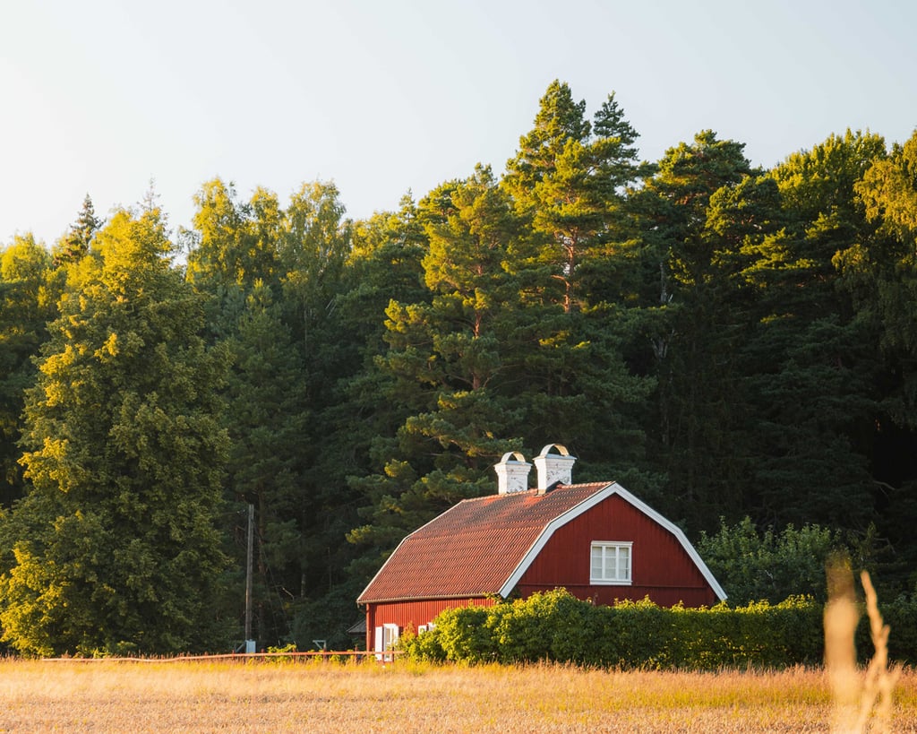 Red barn house with gambrel roof