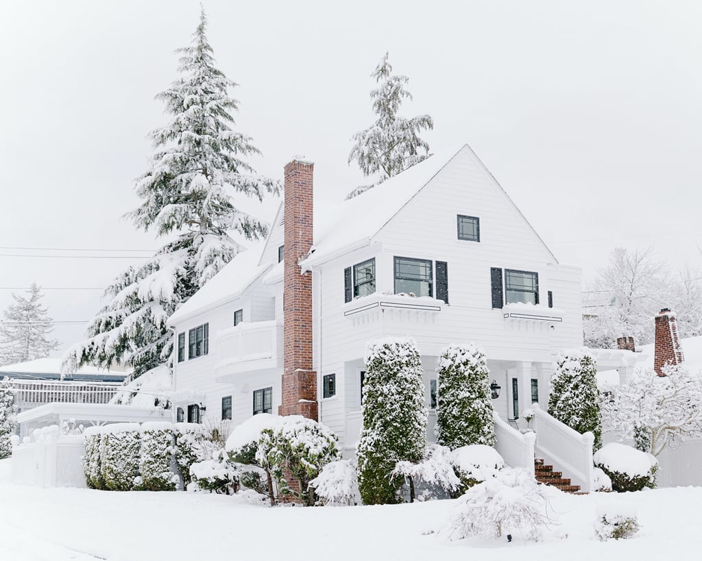Black and white farmhouse with black window trim
