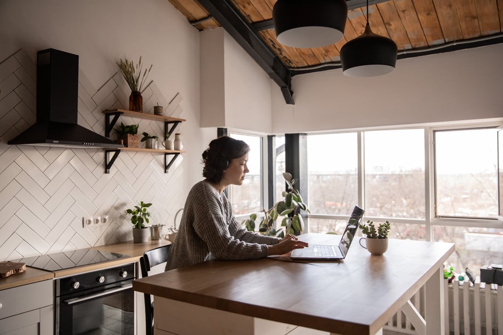 Woman in modern black and white farmhouse kitchen
