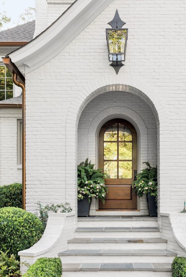 Copper gutters white house with brick exterior