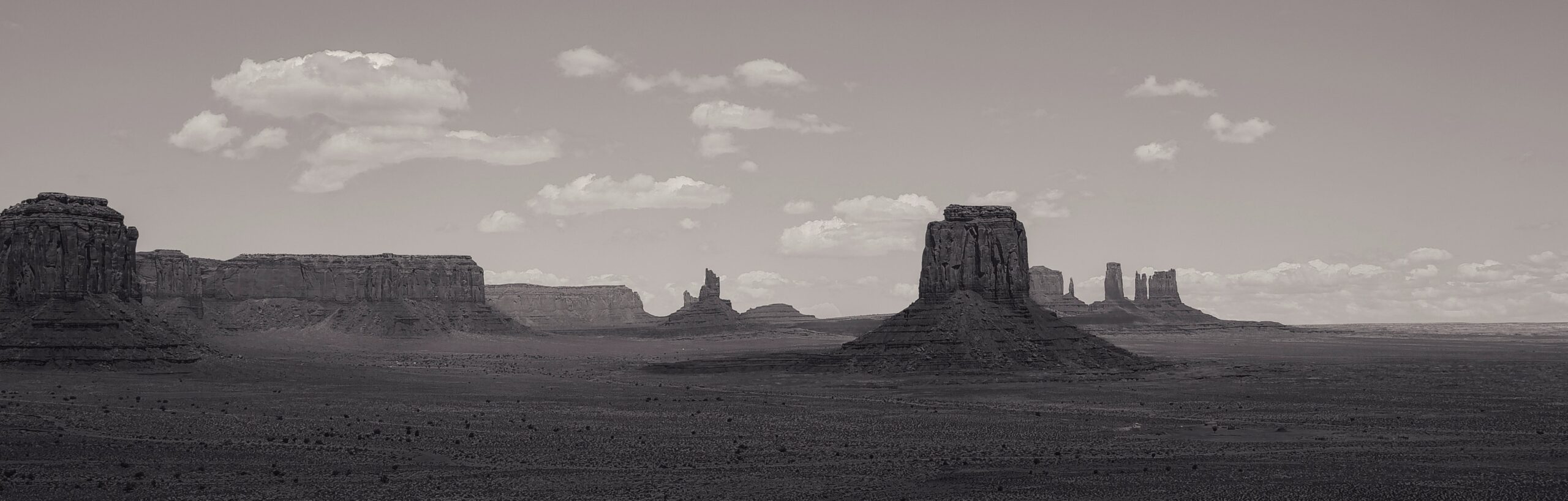 A Southern Utah landscape with large rock formations in the desert.